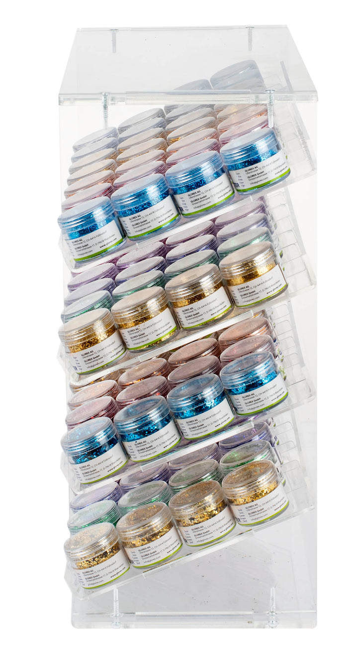 Das Glorex Bio-Glitter Display 112tlg besteht aus einem durchsichtigen Acrylgehäuse mit mehreren geneigten Reihen, die jeweils kleine runde Behälter mit bunten Deckeln enthalten - ideal für die Präsentation und den Zugriff auf biologisch abbaubares Bio-Glitter.