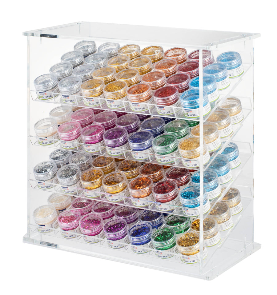 Das Glorex Bio-Glitter Display 112tlg ist ein klarer Acryl-Organisator mit fünf Reihen kleiner Kunststoffdosen, die mit verschiedenen Glitterfarben - Gold, Silber, Blau, Rot, Lila und Grün - gefüllt sind, übersichtlich angeordnet und leicht zu erkennen.