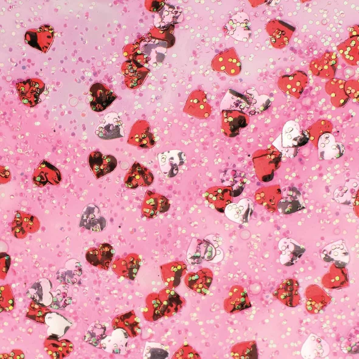 Colle pailletée Confetti avec cœurs rouges et argentés, texture scintillante
